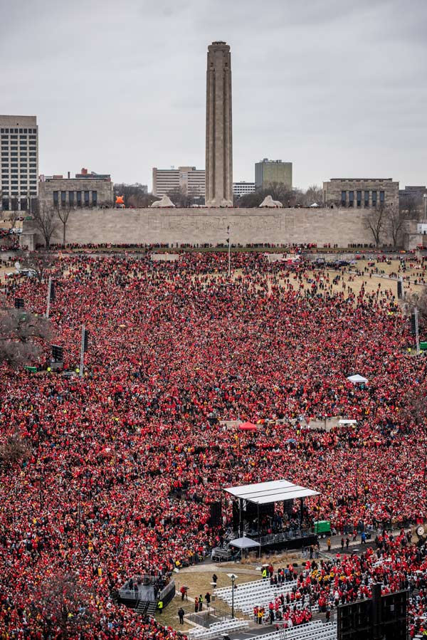 Aerial photograph of the North Lawn of the Liberty Memorial. An enormous crowd fills the space all dressed in red.