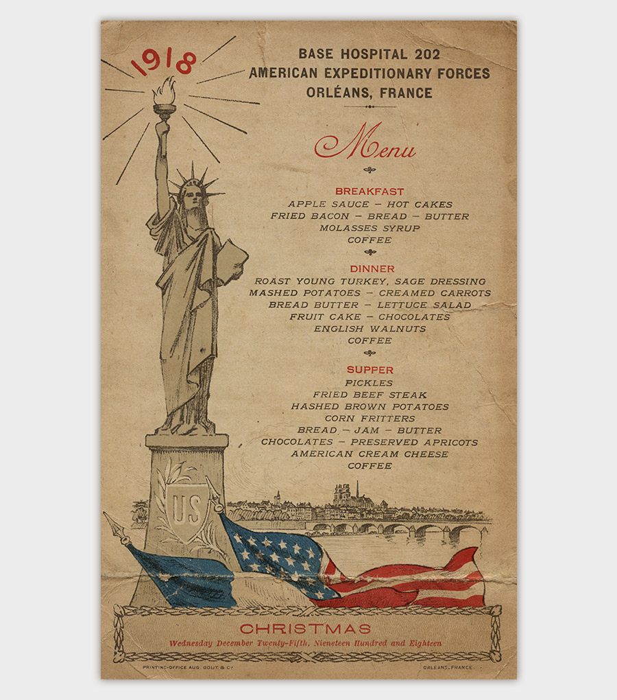 1918 Base Hospital No. 202 Christmas Menu from Orleans, France. The menu includes information about Breakfast, Dinner, and Supper. The Statue of Liberty is printed on the left side.
