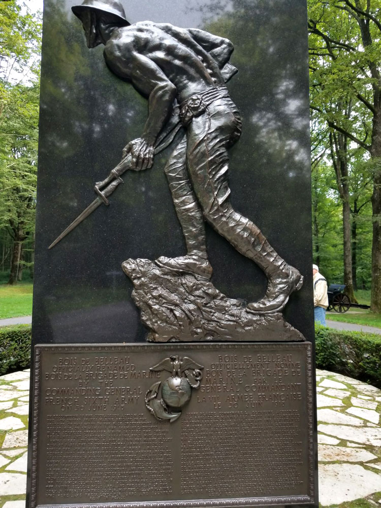 Bas-relief statue of a soldier striding forward with his bayonet.
