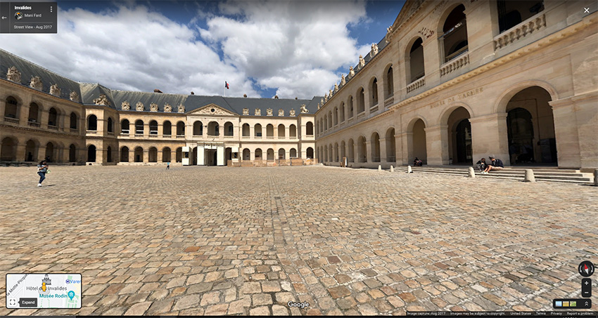 Google Streetview of a stone courtyard bounded by medieval stone buildings.