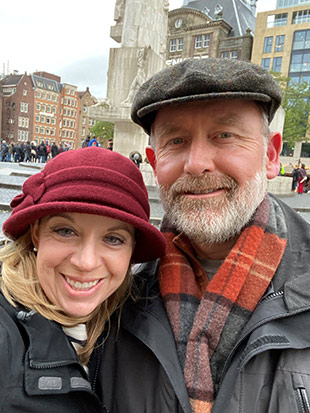 Selfie photograph of a white couple wearing winter clothing and hats.