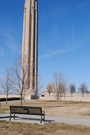 Metal park bench located near the Liberty Memorial Tower