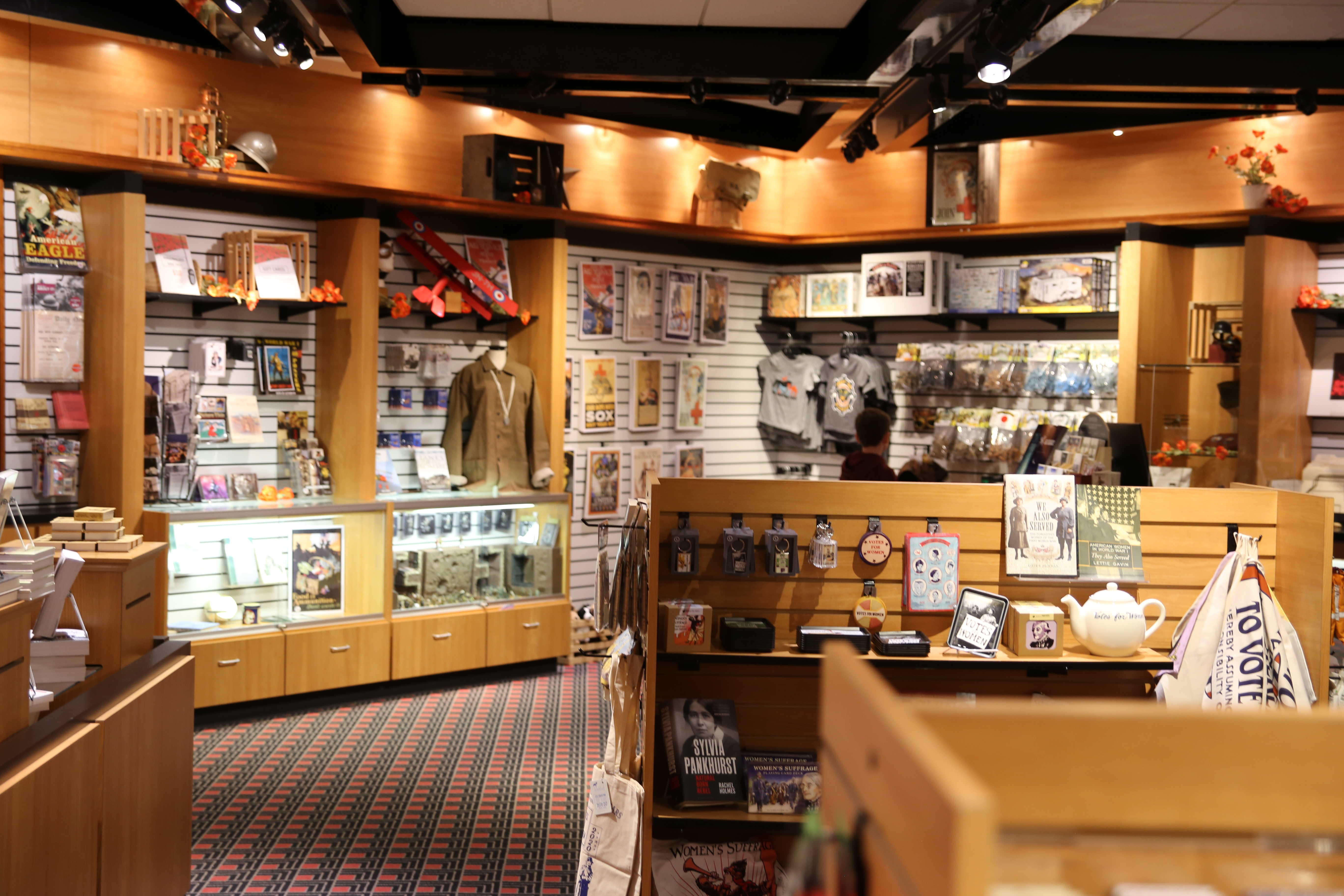 Interior of the museum store with shelves of gifts, t-shirts, and other items