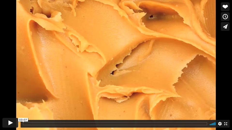 Thumbnail of peanut butter spread in thick waves.