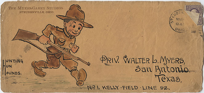 Scan of a vintage envelope. Painted with a cartoon of a soldier trotting forward with bayonet at the ready. Text: 'Hunting Hun Hounds'