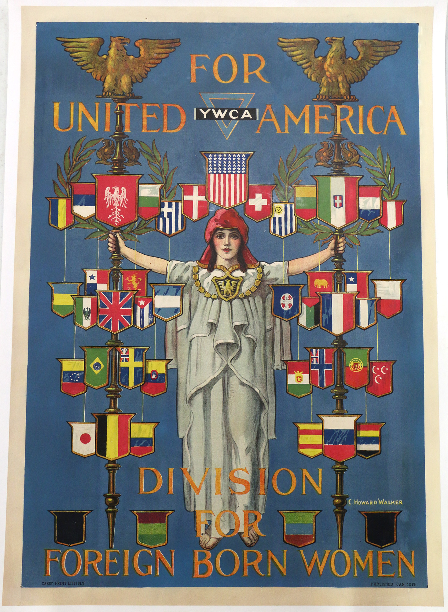 A painting of a young white woman dressed in white robes with oustretched arms, surrounded by flags of many nations. Text: 'YWCA for United America / Division of Foreign Born Women'