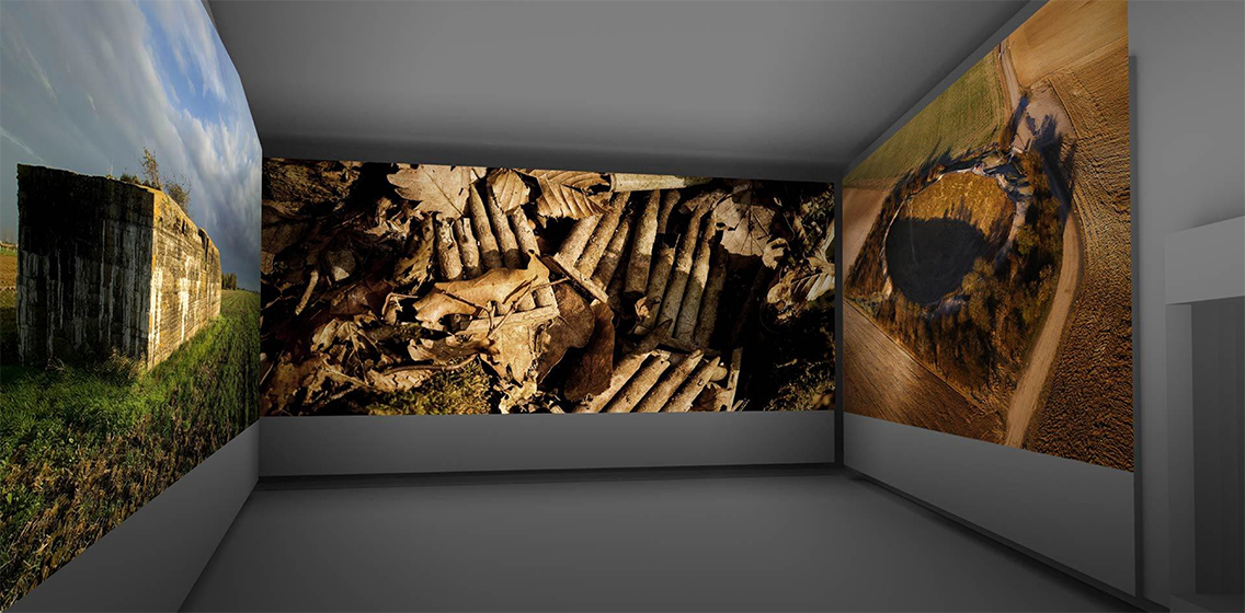 Computer rendering of a room bounded on three sides by walls covered in floor-to-ceiling projections of modern-day photos of WWI battlefields