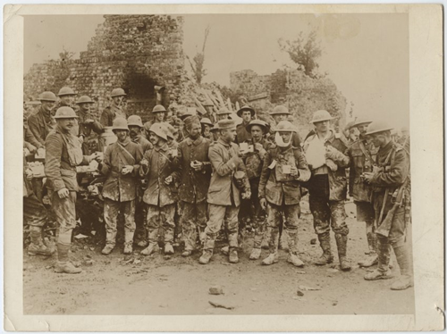 A group of male soldiers carrying mugs and biscuits, wearing two different uniform types