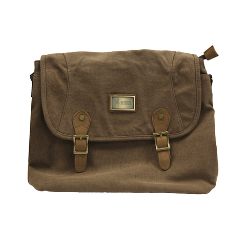 A dark brown canvas shoulder bag with buckle straps and a small brass plate engraved with the Museum and Memorial logo.