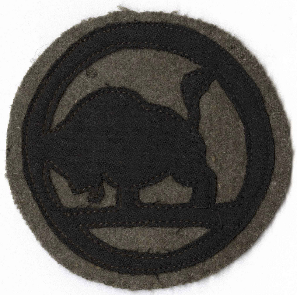 Black and brown insignia patch depicting a silhouette of a bison