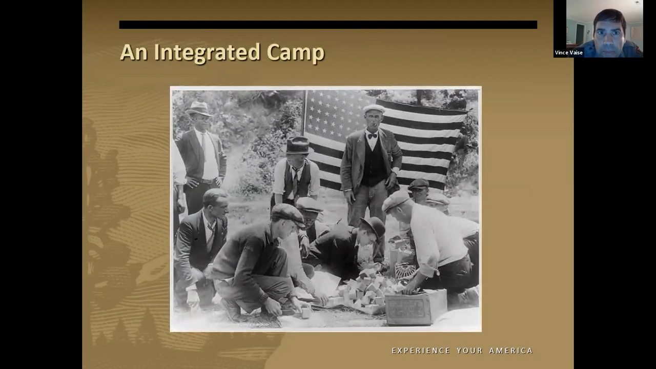 Black and white photo of Black men and white men performing some kind of task involving stacks of blocks