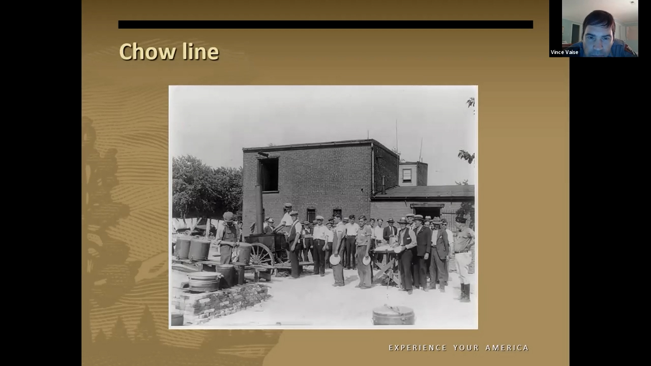 Black and white photo of a queue of people outside a building