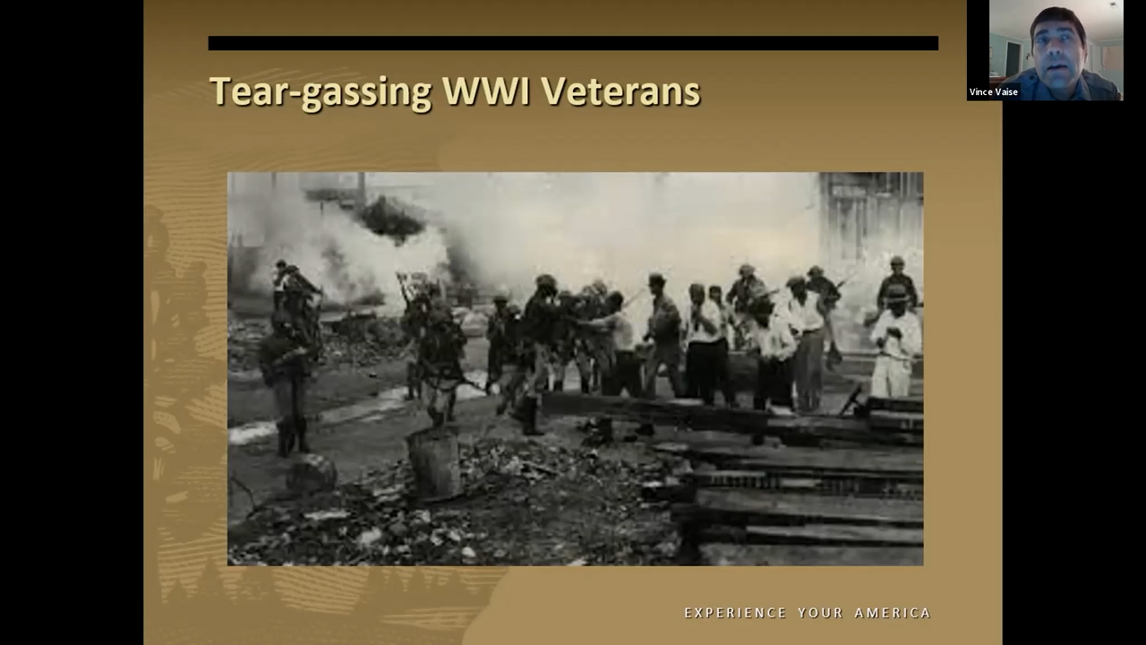 Men in civilian clothes stumbling away from clouds of gas being released by soldiers wearing gas masks