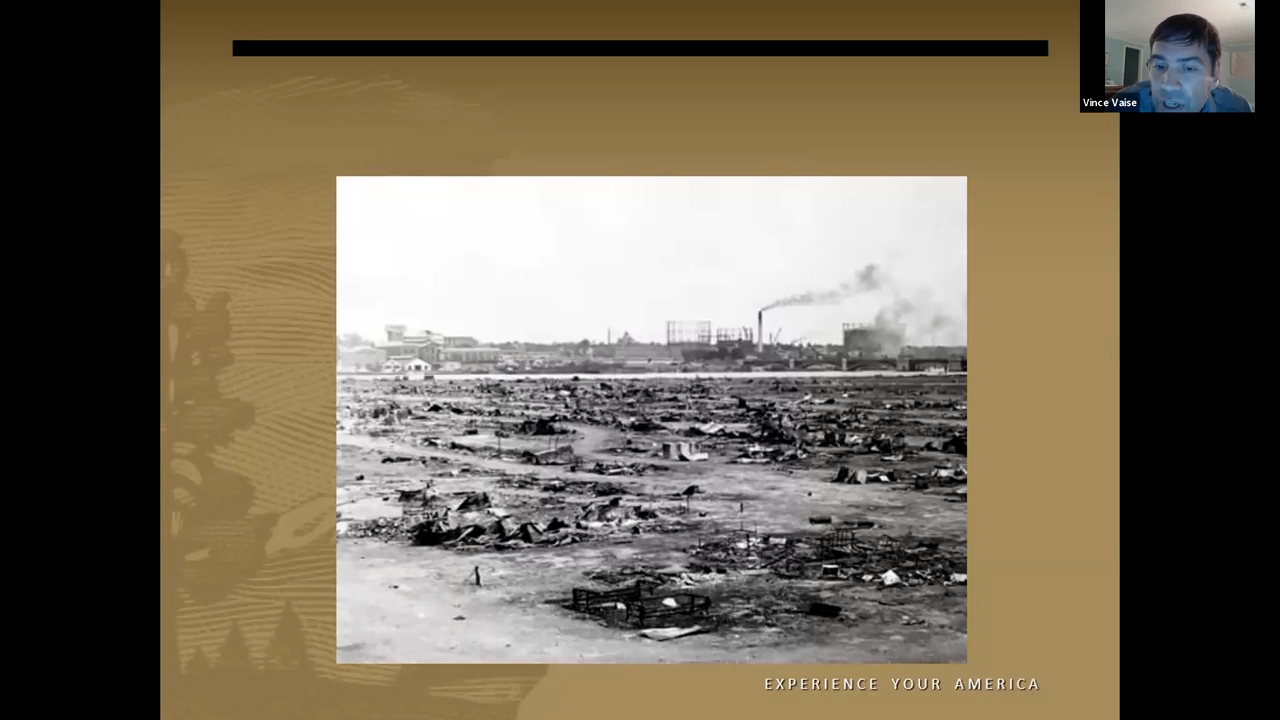 Black and white photo of smoking, flattened ruins stretching to the horizon