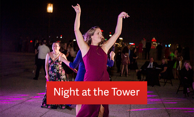 Nighttime on the Memorial Courtyard. A white woman in a cocktail gown is dancing. Text: 'Night at the Tower'