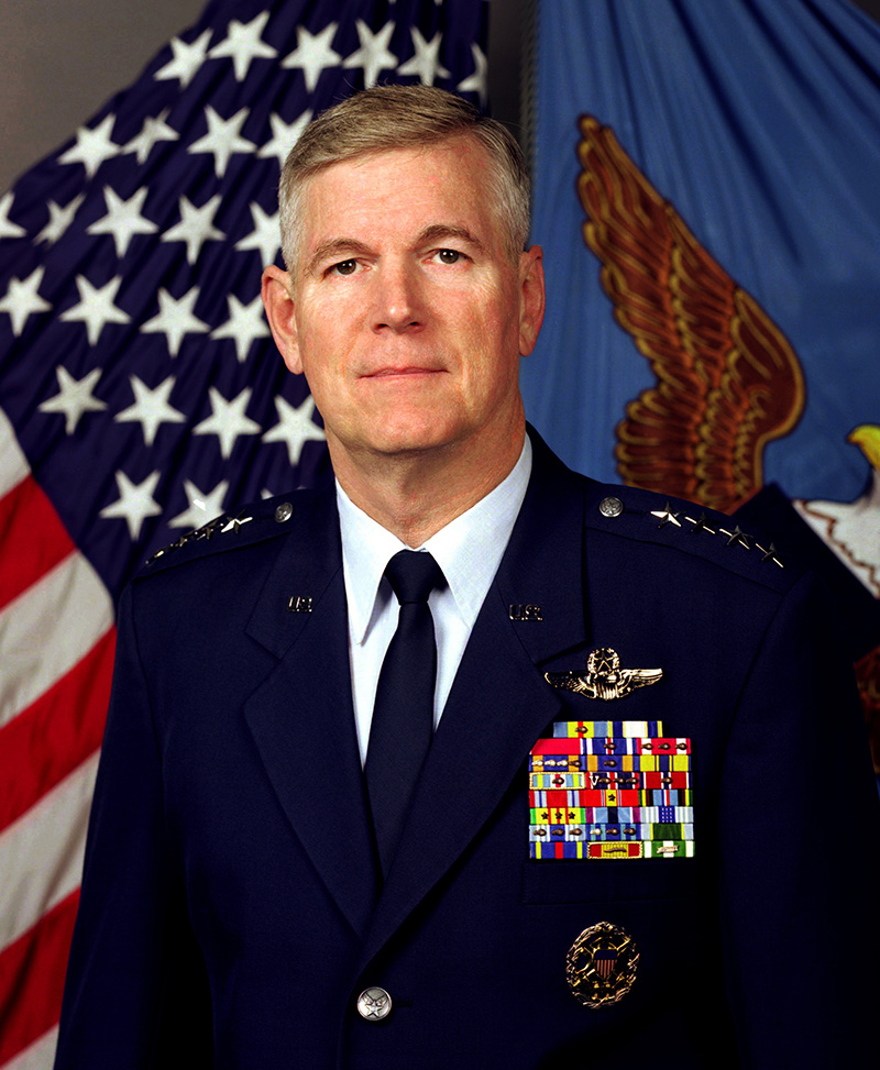 Modern portrait photo of an older man with greying hair wearing a military uniform