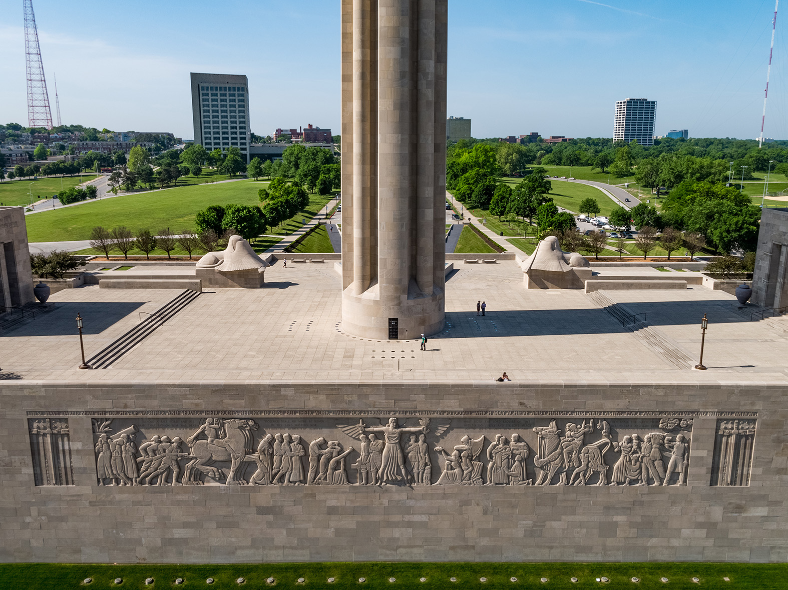 Modern aerial photo of the North Wall with a massive bas-relief frieze carved into it. Beyond the wall is Memorial Courtyard, Liberty Memorial Tower and the south lawns.
