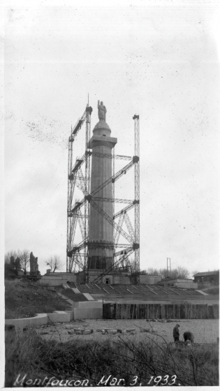 Black and white photograph of a monument being built.