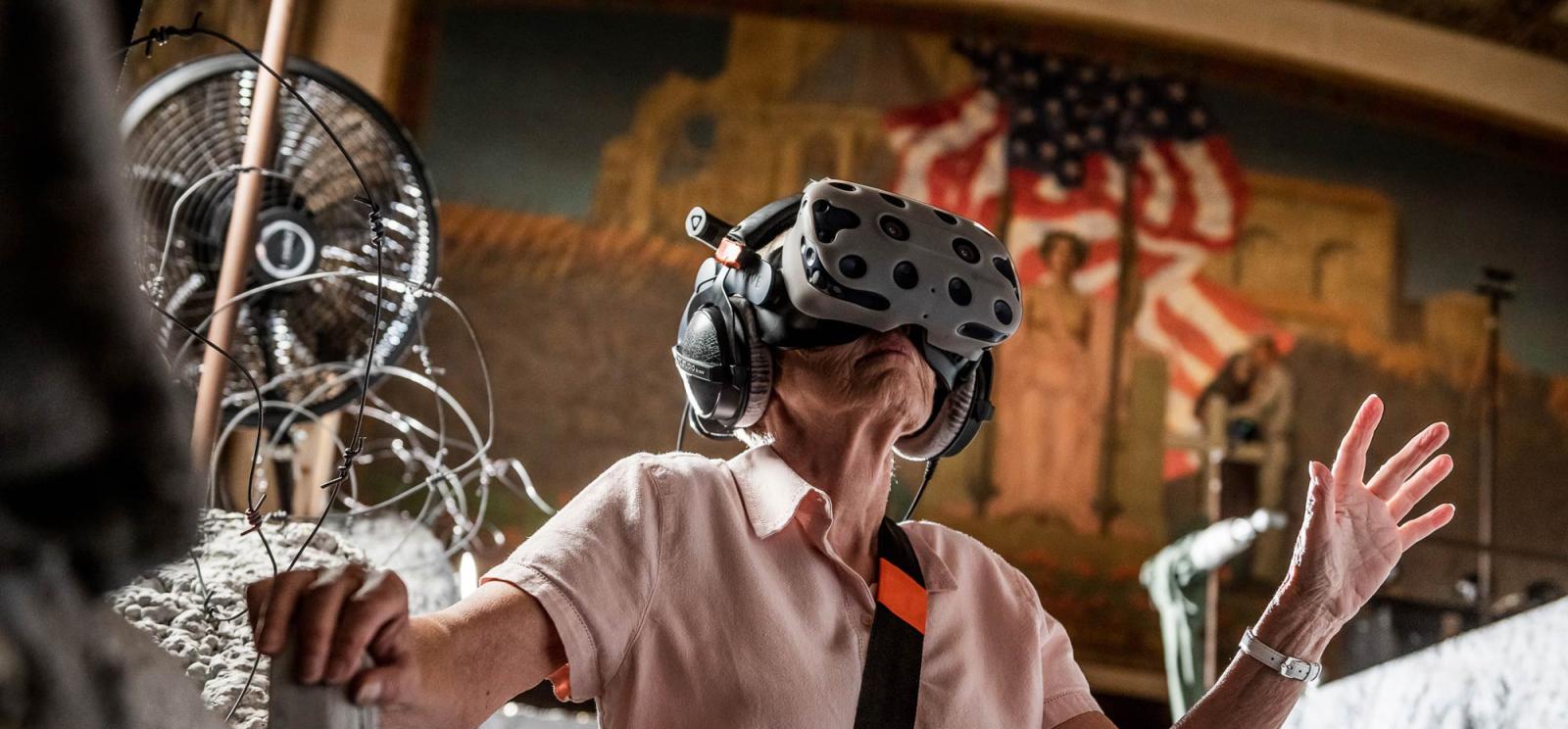 Woman wearing a VR headset in War Remains