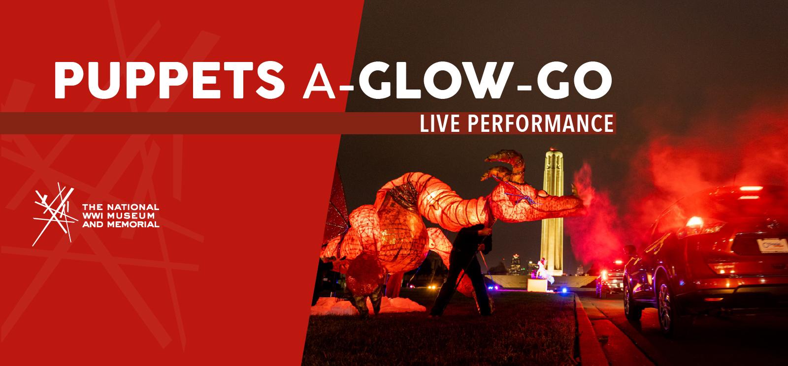 Image: Modern photograph of a giant red dragon puppet breathing 'smoke' at a car with the Liberty Memorial Tower in the background. Text: 'Puppets a-Glow-Go / Live Performance'