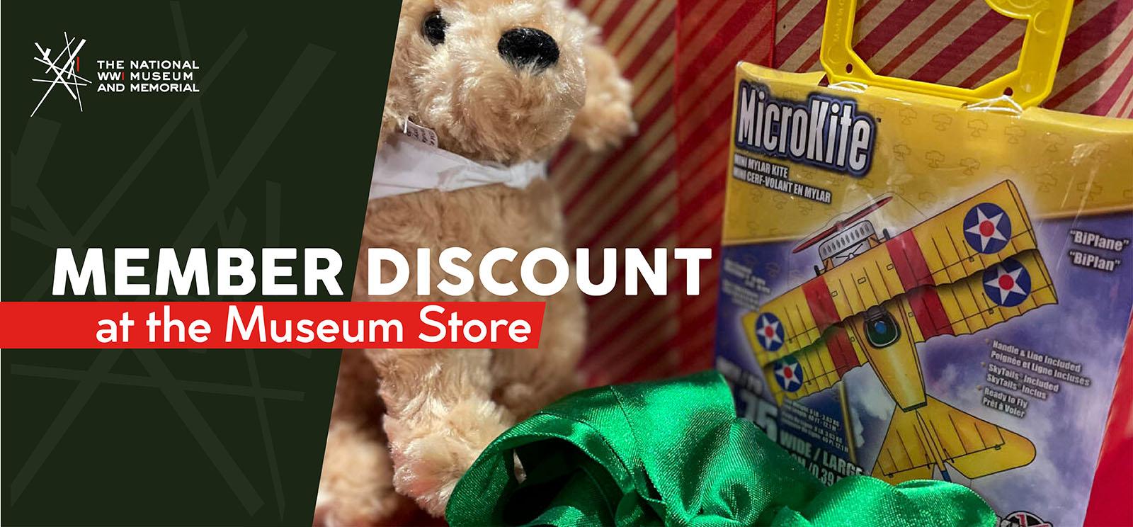 Image: Modern photograph of a pile of gifts including a golden dog plushie and a biplane-shaped kite. Text: 'Member Discount at the Museum Store'