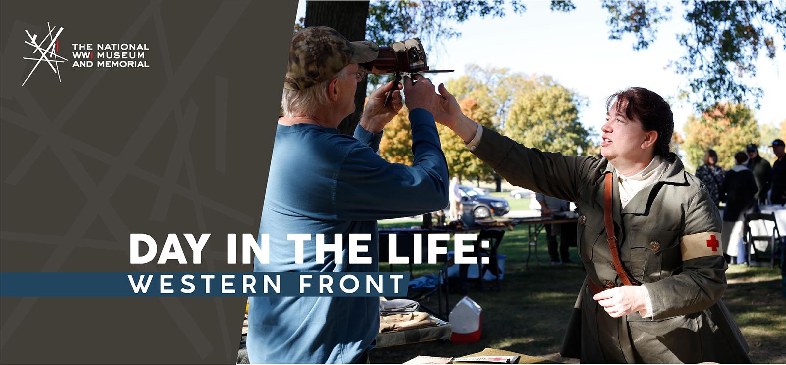 Image: Modern photograph of a white woman dressed in a WWI-era military uniform reaching up to help a taller white man who is holding a WWI-era stereoscope to his eyes. Text: 'Day in the Life: Western Front'