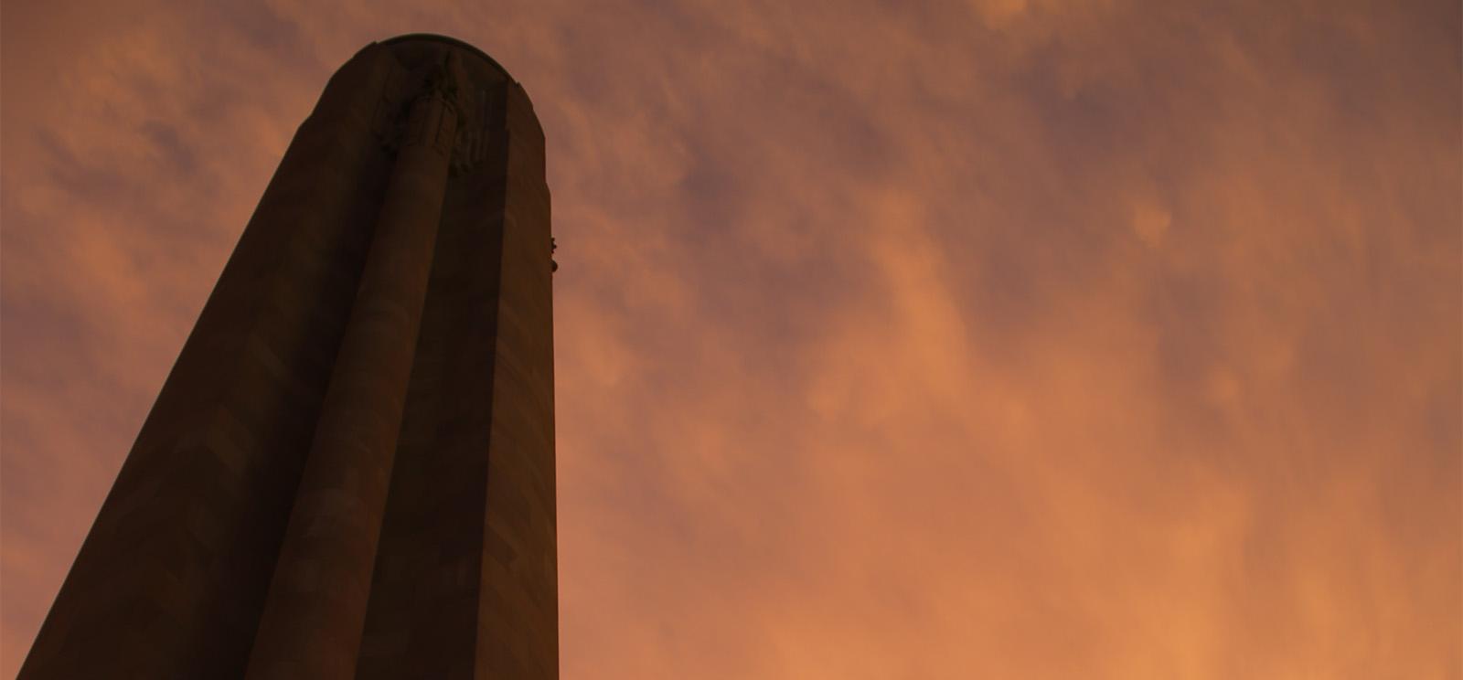 Liberty Memorial Tower illuminated by golden sunset light