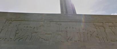 Modern photograph of the Great Frieze on the North Wall of the Liberty Memorial. Carved bas-relief figures populate the frieze: farmers, soldiers, riders on horses, and others.