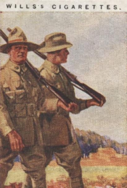 Scan of a card with a painting of two WWI-era British soldiers marching through a field. Text: Wills's Cigarettes