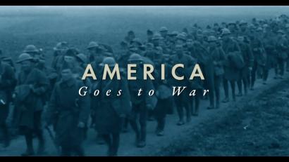 Background image: A column of soldiers marches down a road through empty fields. Foreground text: America Goes to War.
