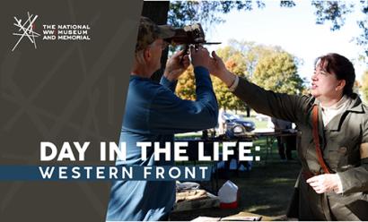 Image: Modern photograph of a white woman dressed in a WWI-era military uniform reaching up to help a taller white man who is holding a WWI-era stereoscope to his eyes. Text: 'Day in the Life: Western Front'