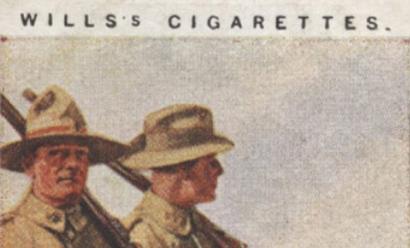 Scan of a card with a painting of two WWI-era British soldiers marching through a field. Text: Wills's Cigarettes