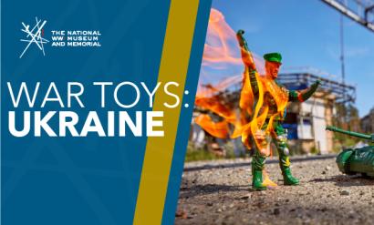 Image: A plastic green army man stands, engulfed in orange flames on the left side of the photograph. On the right side, bearing the Ukraine flag, sits a plastic green army tank aimed towards the army man. Text: 'War Toys: / Ukraine'