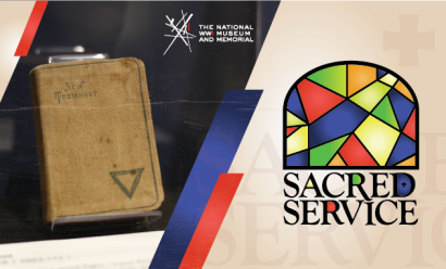 Image: Modern photograph of a WWI-era New Testament bound in brown canvas displayed in a museum exhibit. Text: 'Sacred Service'