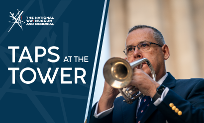Modern photograph of a man wearing a blue suit playing a trumpet with the Liberty Memorial Tower in the background