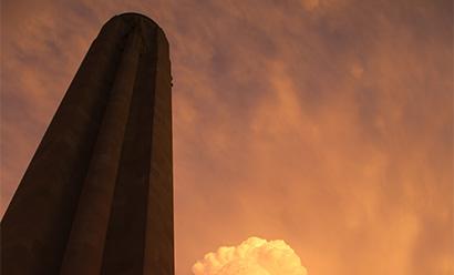Liberty Memorial Tower illuminated by golden sunset light