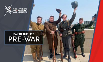 Modern photograph of four young white men in different WWI military uniforms waving their caps and helmets in greeting
