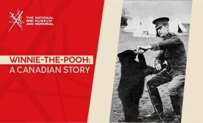 Black and white photo of a white man in WWI military uniform feeding a black bear cub