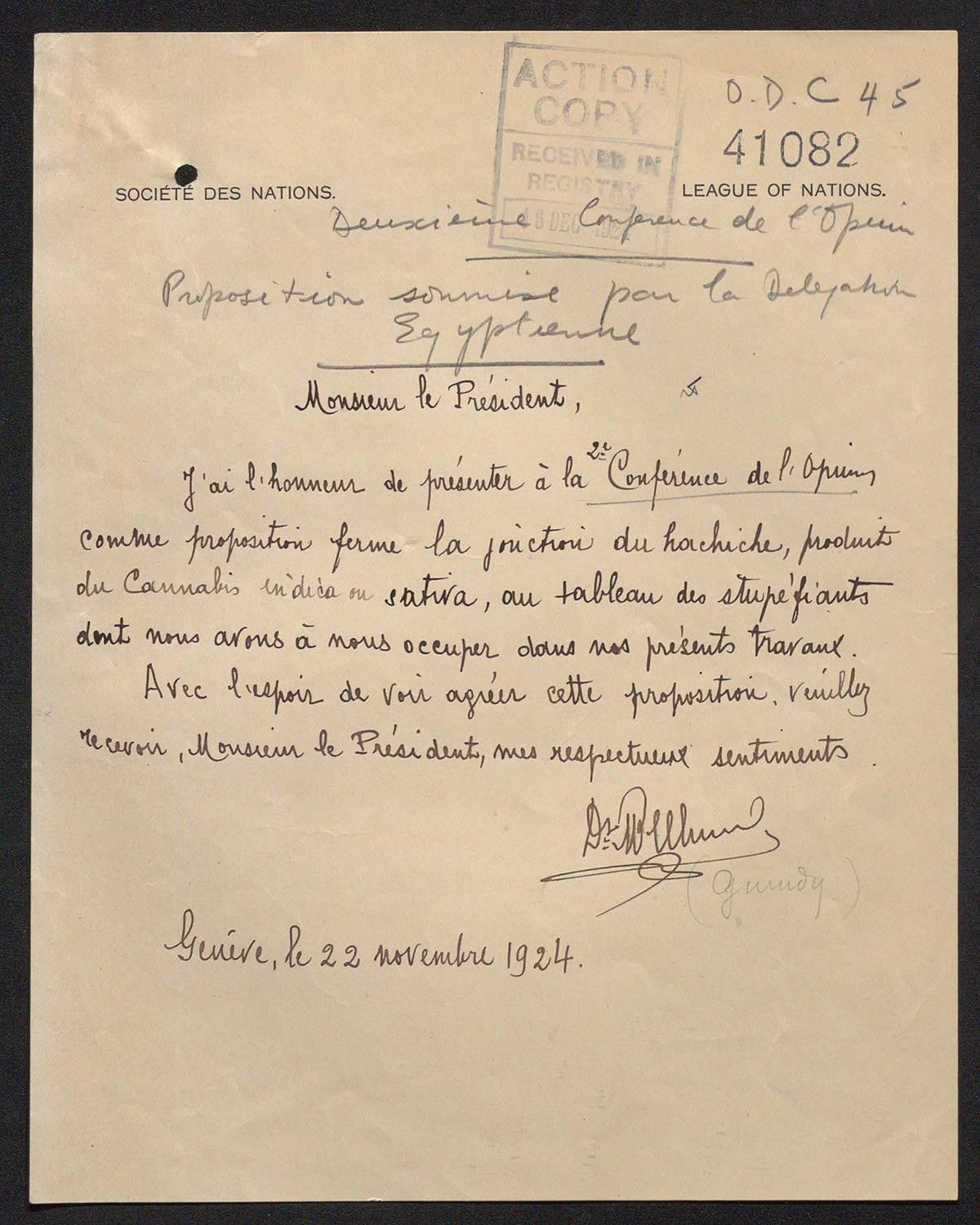 Scan of a yellowing piece of official stationery with cursive handwriting in French on it