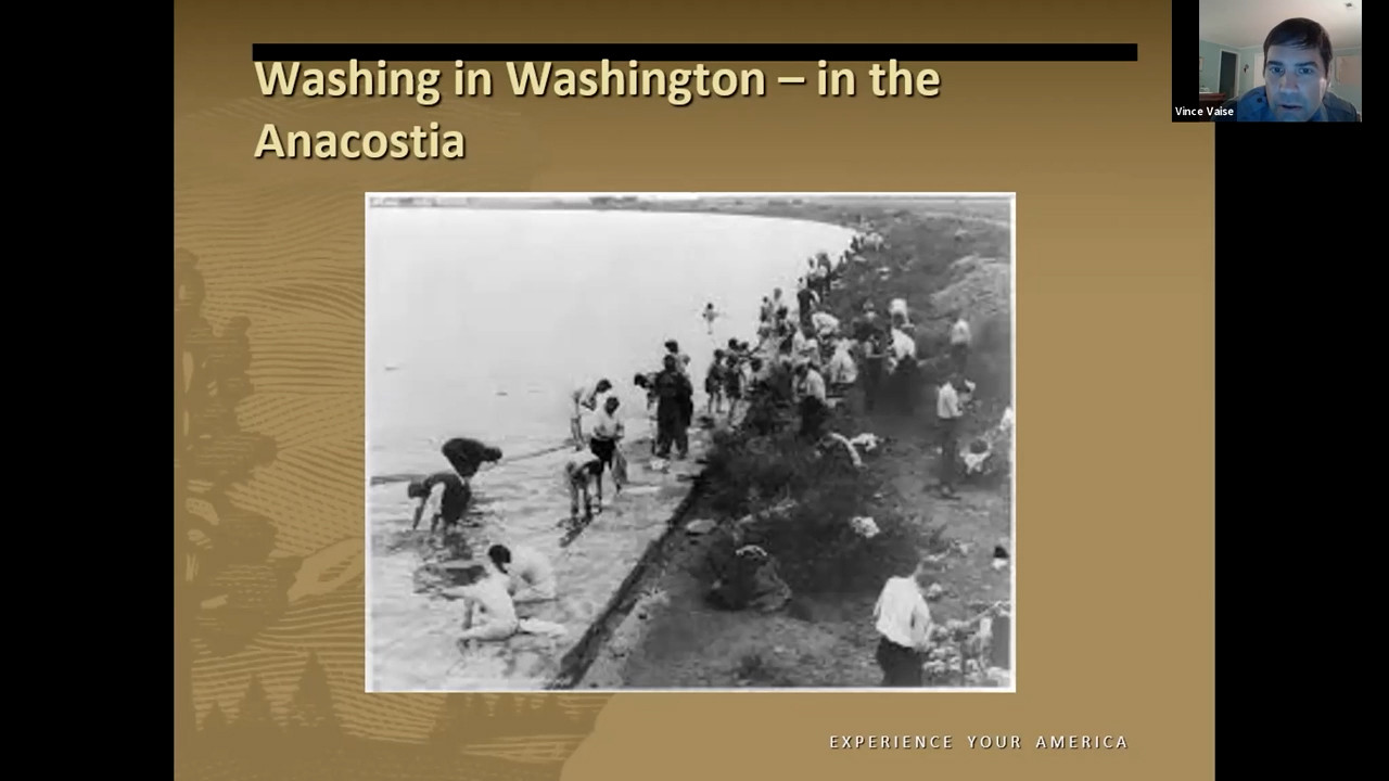 Black and white phot of men bathing in a river