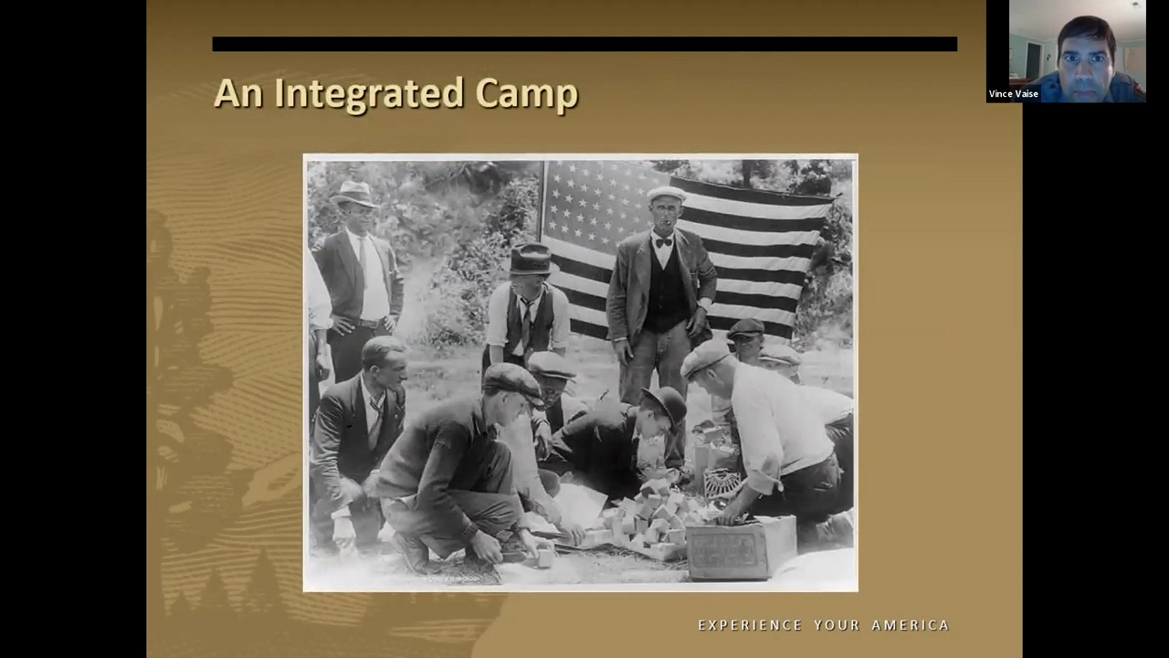 Black and white photo of Black men and white men performing some kind of task involving stacks of blocks