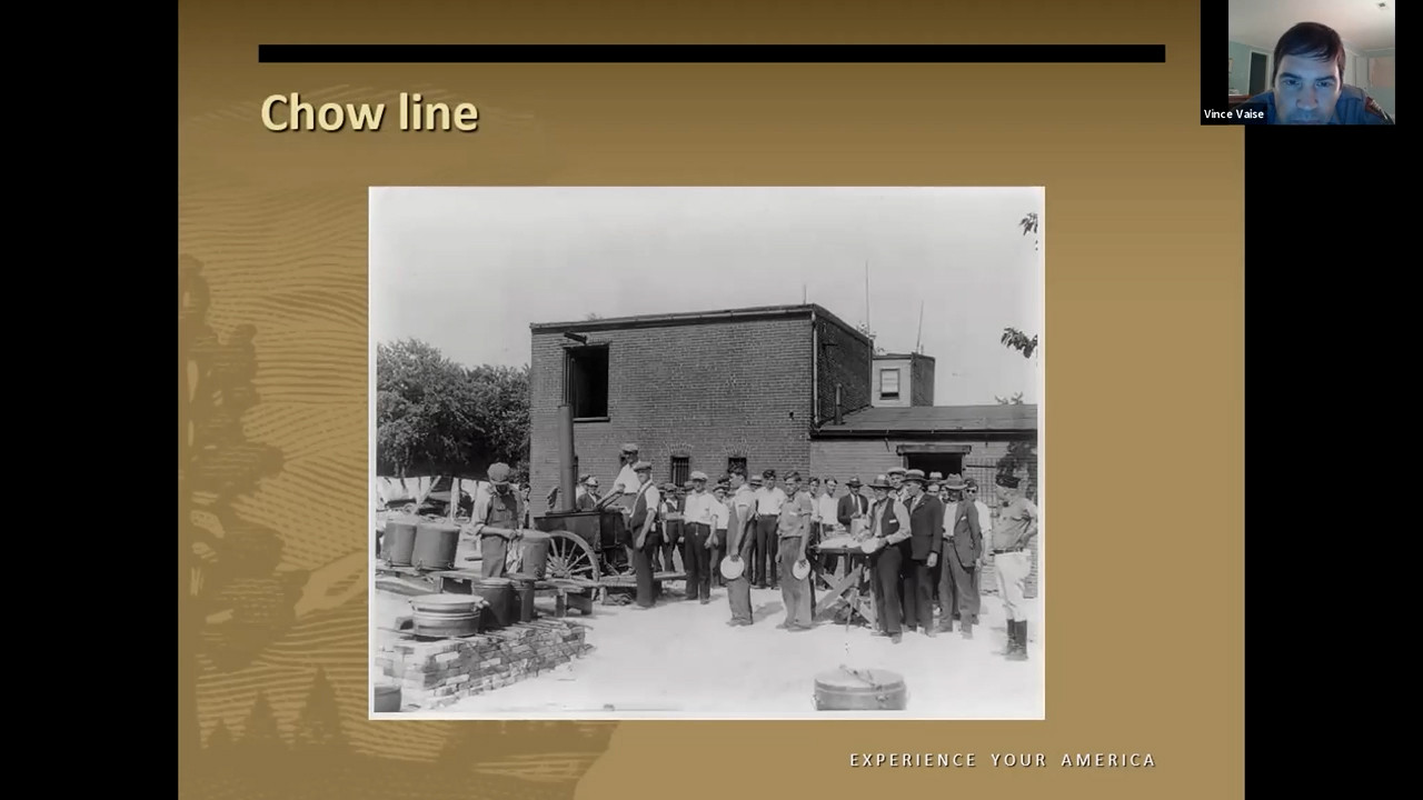 Black and white photo of a queue of people outside a building