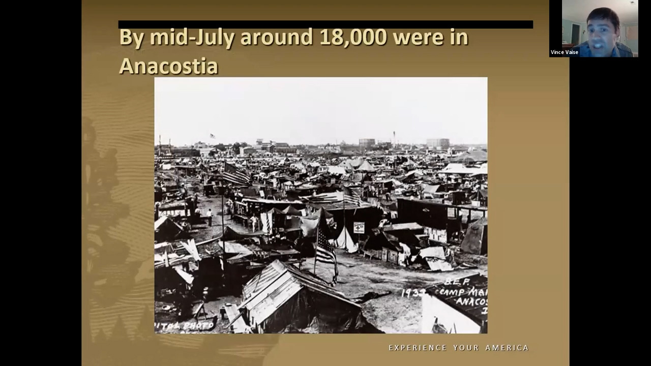 Black and white photo of tents and shacks stretching away to the horizon