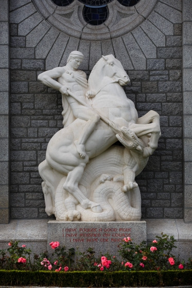 Color photograph of a statue of a horse with a person riding it.