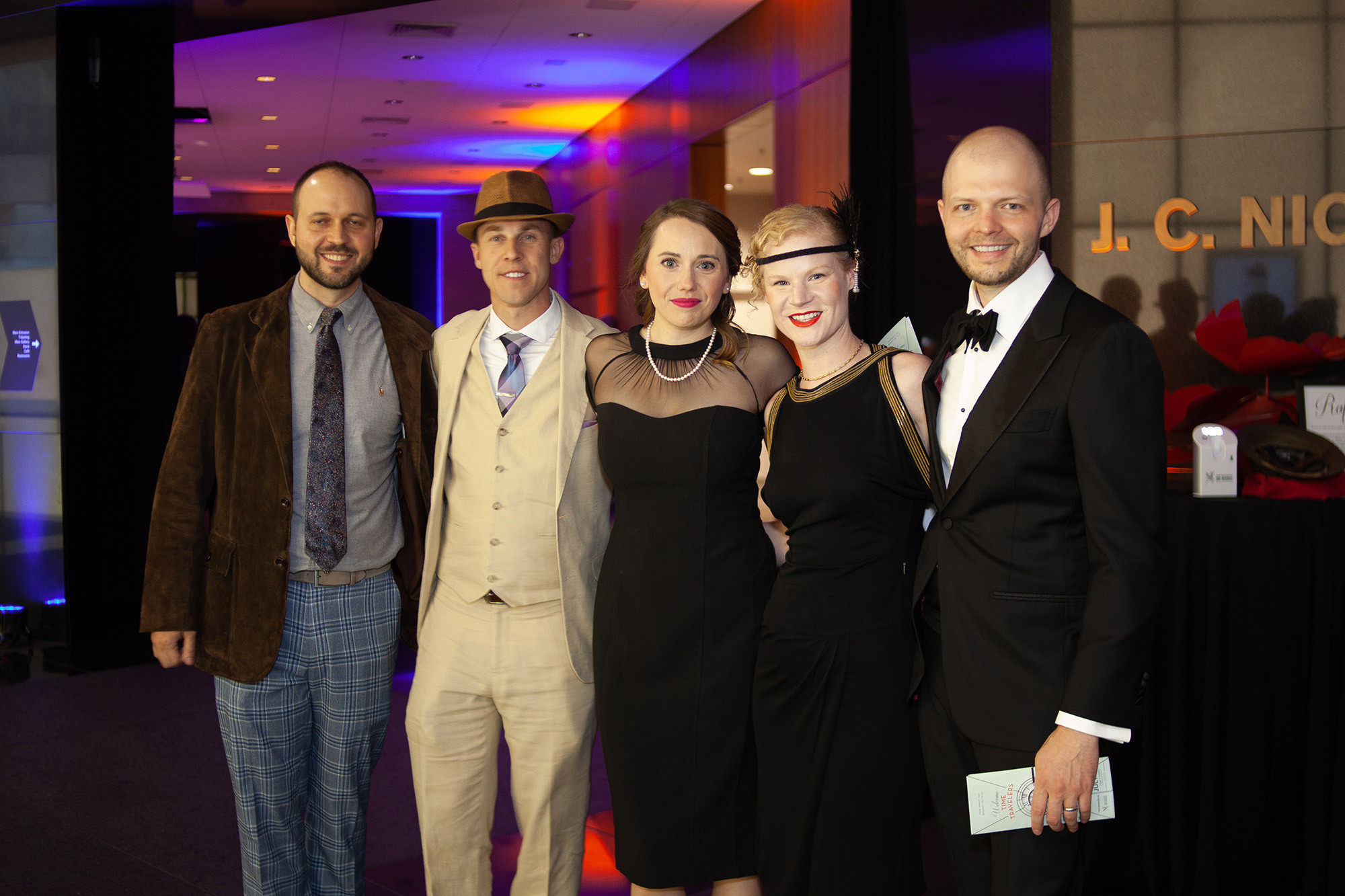 Modern photo of guests dressed in a mix of 1920s party clothes