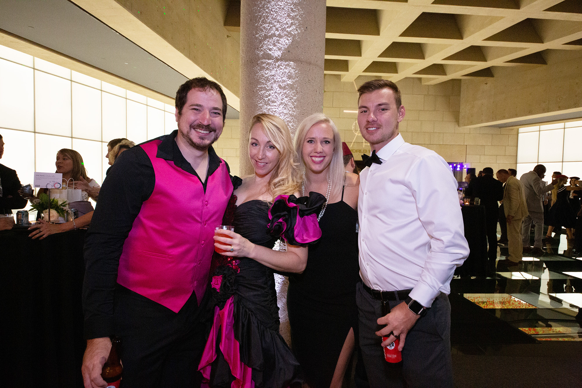 Modern photo of guests dressed in vaguely 1980s-inspired prom wear